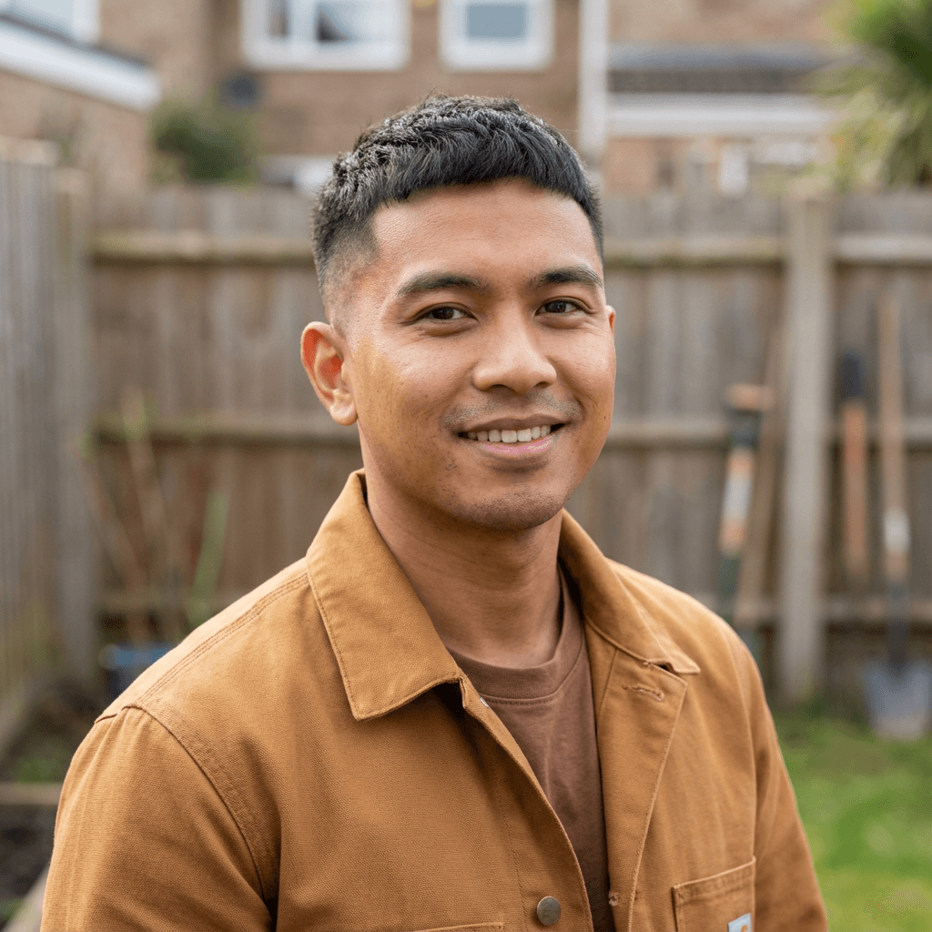 Daniel R. in casual work clothes at home